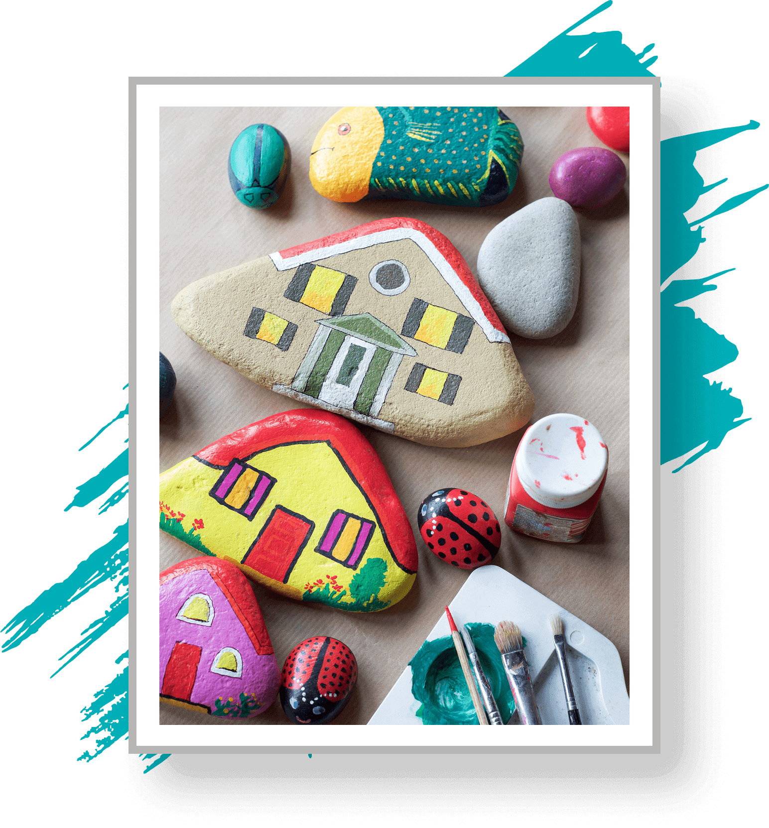 Painted stones with house designs and ladybugs.