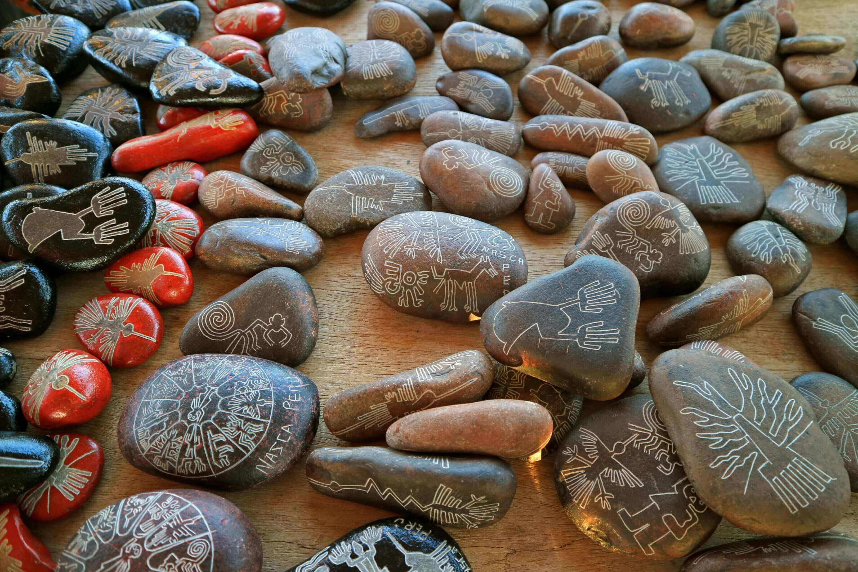 Engraved stones with various intricate designs.
