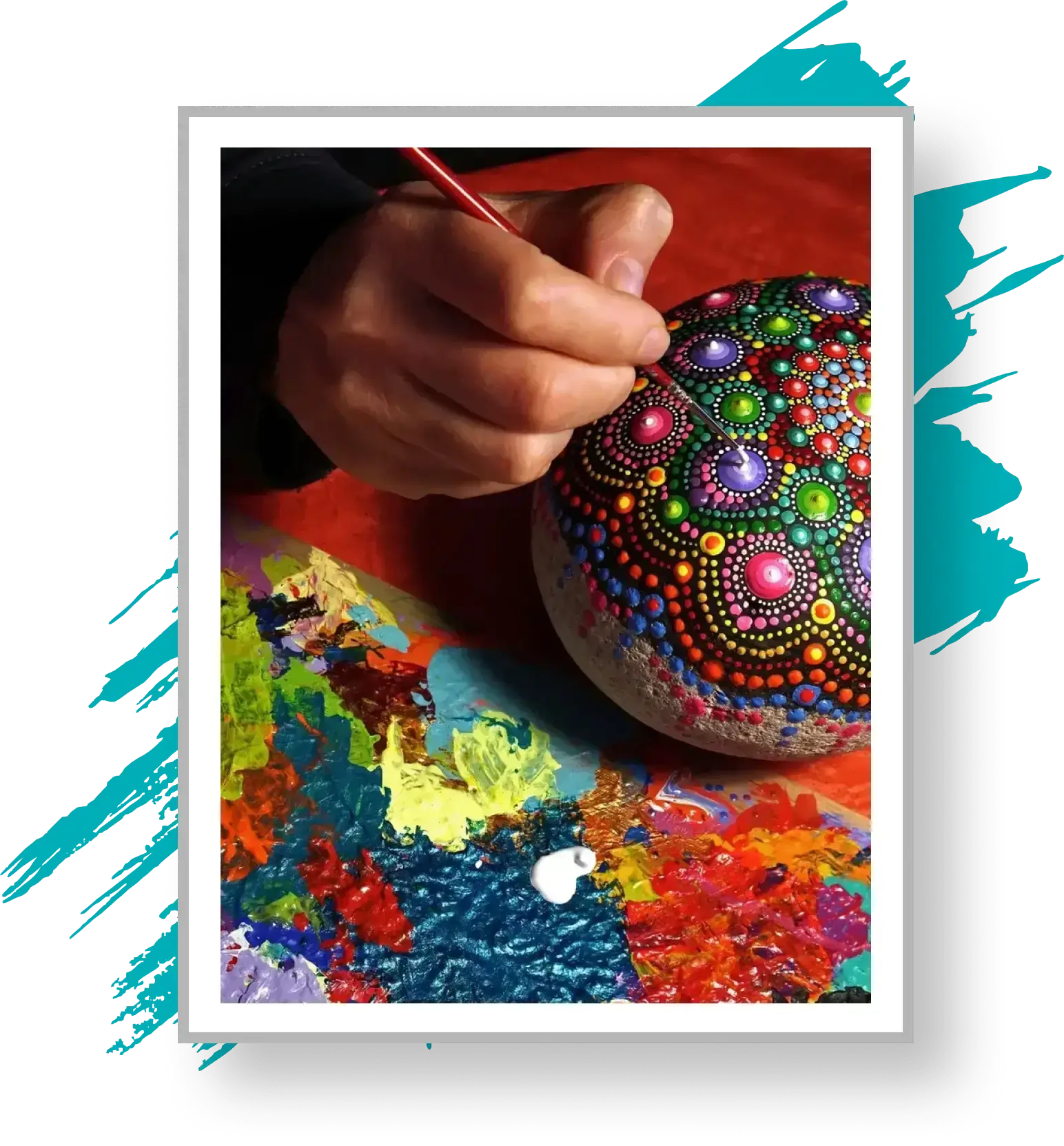 Hand painting colorful mandala on stone.